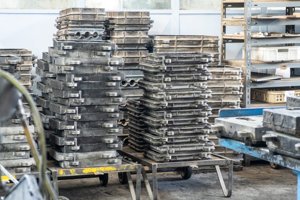 Large metal presses for the manufacture of various shapes of glass products are in stock in
